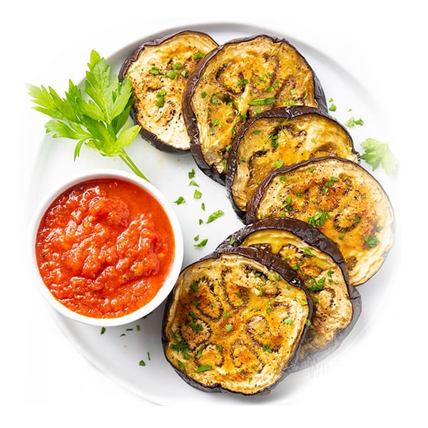 Baked eggplants in orange sauce with walnuts