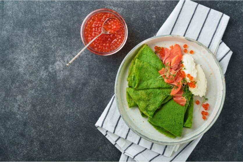 Spinach Crepes with Red Caviar and Salmon: A Gourmet Twist with a Rich History